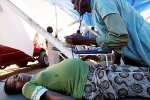 Health workers often work in extremely difficult conditions. Photo WHO 2010.